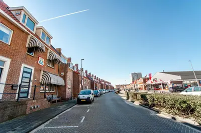 a street with cars parked on the side of a building at Pension Sixtysix in Zandvoort