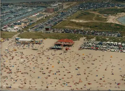 an overhead view of a crowded beach with people at Chalet Jade in IJmuiden