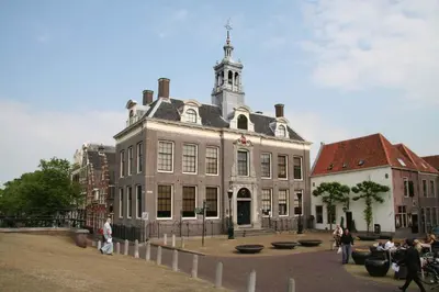 a large building with a tower on top of it at B&B-Edam in Edam