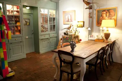 a dining room with a wooden table and chairs at B&B Herengracht 21 in Amsterdam