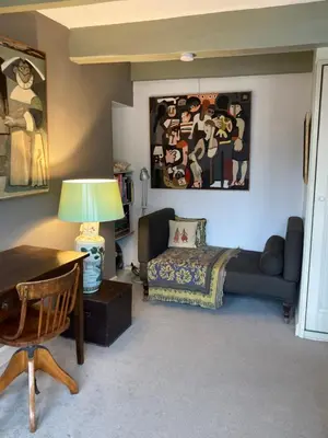 a living room with a couch and a table at B&B Herengracht 21 in Amsterdam