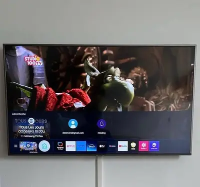 a flat screen tv sitting on top of a cabinet at The Beach House in Noordwijkerhout