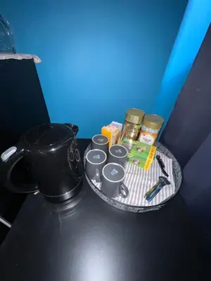 a tray with food and a pot on a table at Nes B&B in Amsterdam