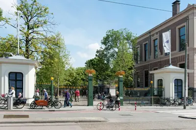 a group of people standing in front of a fence at Artis Plantage Apartment in Amsterdam