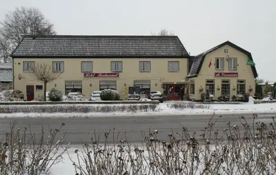 a building on the side of a road at De Vooroever in Wervershoof