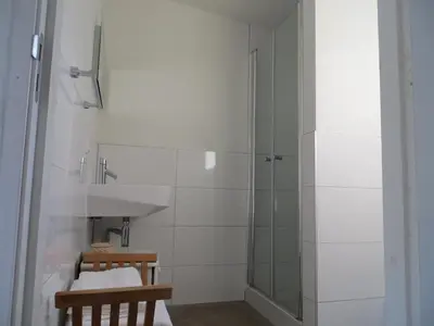 a bathroom with a shower and a sink at Zen in Schoorl in Schoorl