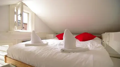 a bed with two santa hats on top of it at Loft Leidsegracht in Amsterdam
