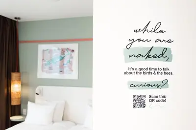 a bedroom with a bed and a sign that reads while you are needed at Conscious Hotel Vondelpark in Amsterdam