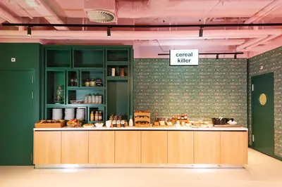 a kitchen with a counter and a sign that readscial mixer at Conscious Hotel Vondelpark in Amsterdam