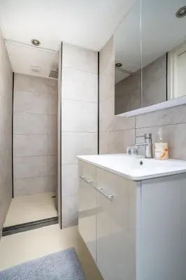 a bathroom with a sink and a shower at Yess in Vinkeveen