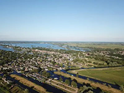 an aerial view of a town next to a river at Yess in Vinkeveen