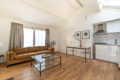 a living room with a couch and a table at Yess in Vinkeveen