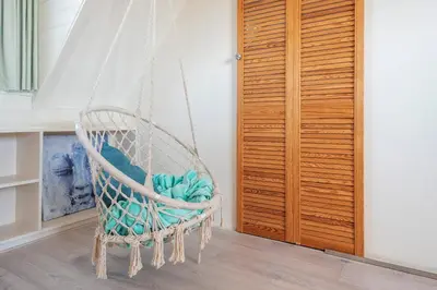 a rope swing in a room with at B&B Little Miss Sunshine in Zandvoort