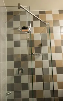 a bathroom with a shower with a glass door at Linden Hotel in Amsterdam