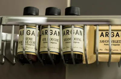 a row of air cans on a shelf at Linden Hotel in Amsterdam