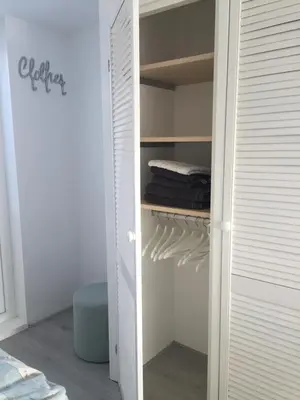 a closet with a door open to a closet with towels at Casa Belle Dune in Zandvoort