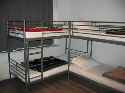 a bunk bed room with two bunk beds in it at Guest House Amsterdam in Amsterdam