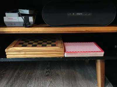 a shelf with a chess board and a microwave at 7B&B in Amsterdam