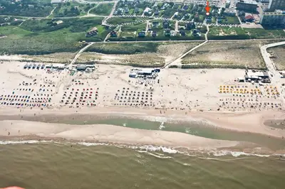 an aerial view of a beach and the ocean at Salt Life Beachhouse in Noordwijk aan Zee