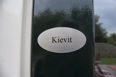 a sign on the side of a building with the word ketchup at De Willigen Logies in Vreeland