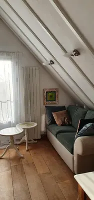 a living room with a couch and a table at Sterrenhoeve in Castricum