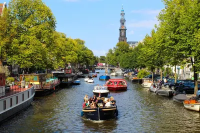 a group of people on a boat in a canal at Appartement Kwaak in Zandvoort