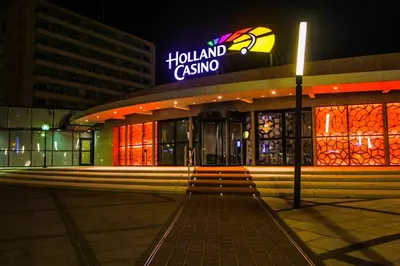 a building with a sign on top of it at night at Appartement Kwaak in Zandvoort