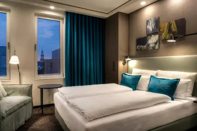 a hotel room with a bed and a window at Motel One Amsterdam-Waterlooplein in Amsterdam