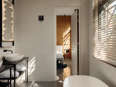 a white bathroom with a sink and a mirror at Conscious Hotel Westerpark in Amsterdam
