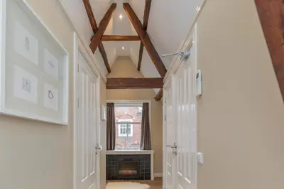 a hallway with a fireplace in a house at ExLibris Boutique Hotel in Leiden