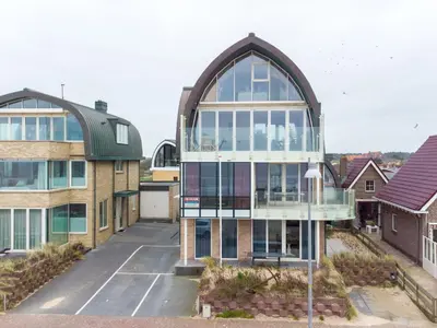 an aerial view of a building with a large window at Apartment De Zeeparel by Interhome in Egmond aan Zee