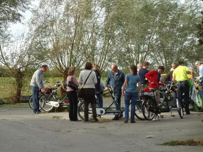 a group of people standing around with their bikes at Hoeve Meerzicht in Monnickendam