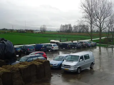 a bunch of cars parked in a parking lot at Hoeve Meerzicht in Monnickendam