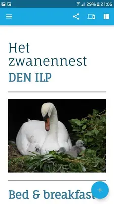 a white swan sitting next to a baby duck at Het Zwanennest in Den Ilp
