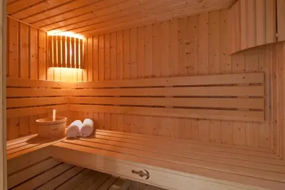 a sauna with two towels sitting on a bench at Van Der Valk Hotel Almere in Almere