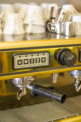 a close up of a clock on a machine at Hotel Larende in Amsterdam