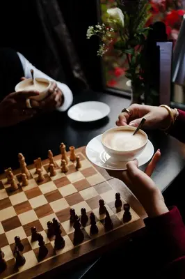 a person playing a game of chess on a chessboard at Canal House in Amsterdam