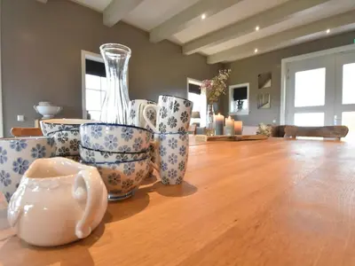 a group of cups and vases sitting on a table at Spacious Holiday Home in the Beemster near a Windmill in Middenbeemster