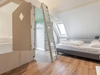 a bedroom with a bunk bed and a ladder at Holiday Home in Beemster by Windmill in Middenbeemster