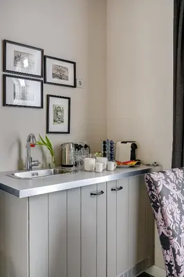 a kitchen with a sink and a counter top at Boutique Hotel 't Vosje in Haarlem
