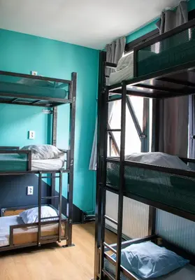 a room with three bunk beds in a hostel at Amsterdam Hostel Leidseplein in Amsterdam