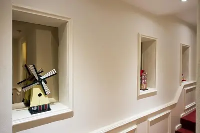 a window in a bathroom with a windmill on it at Rembrandtplein Hotel in Amsterdam