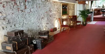 a room with a bunch of suitcases piled up against a wall at Rembrandtplein Hotel in Amsterdam