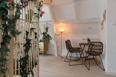 a living room with a table and chairs at Way Up Studio in Amsterdam