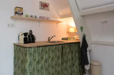 a kitchen with a sink and a counter top at Way Up Studio in Amsterdam