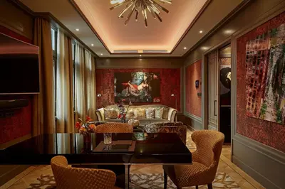 a living room with a couch and a table at Hotel TwentySeven - Small Luxury Hotels of the World in Amsterdam
