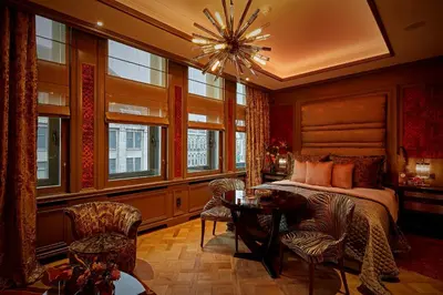 a bedroom with a bed and a table and chairs at Hotel TwentySeven - Small Luxury Hotels of the World in Amsterdam