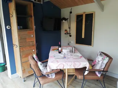 a dining room table with a pink table cloth on it at De Zes Wielen in Alkmaar