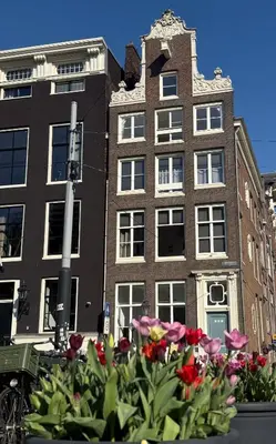 a bunch of flowers in front of a building at Your a Royalty - Equal Design by JoyJoyJoy - Top Floor and Top Views - Creating houses for the poor in Amsterdam