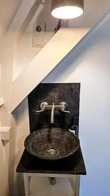 a bathroom with a sink in a attic at Your a Royalty - Equal Design by JoyJoyJoy - Top Floor and Top Views - Creating houses for the poor in Amsterdam